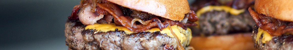 Eating American (Traditional) Burger at Fantastic Burgers restaurant in Long Beach, CA.